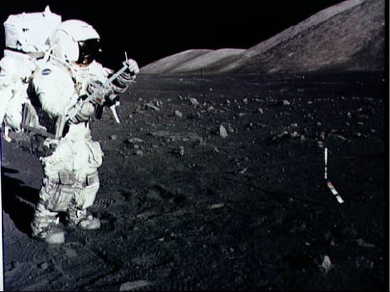 Astronaut Harrison Schmitt collects lunar rake samples during an Apollo 17 moonwalk in December 1973. He is the last man to set foot on the moon.