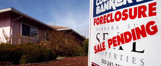 Image: A foreclosed house with sale pending sign is shown in Tigard, Ore.