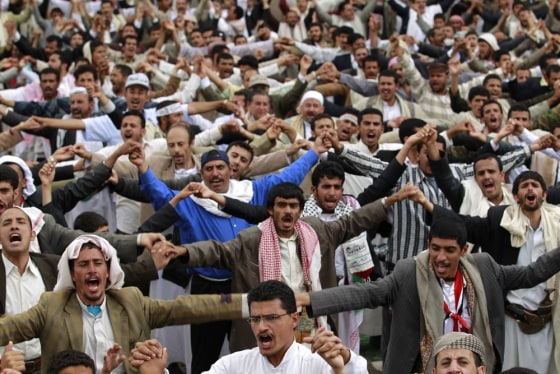 Image: Anti-government protesters shout slogans during a rally to demand the ouster of Yemen's President Ali Abdullah Saleh in Sanaa