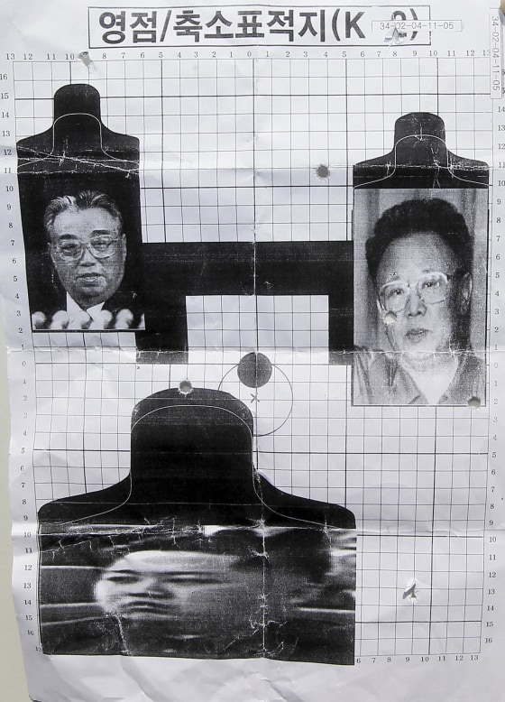 Image: a firing target depicting North Korea's founder Kim Il Sung, left, leader Kim Jong Il, right, and Kim Jong Il's son Kim Jong Un, bottom, used for reserve forces drills in Seoul, South Korea.