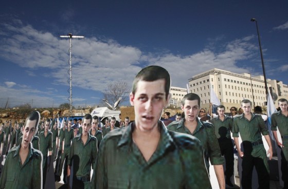 Image: Cardboard cut-outs of captured Israeli soldier Gilad Shalit stand outside Prime Minister Benjamin Netanyahu's office in Jerusalem