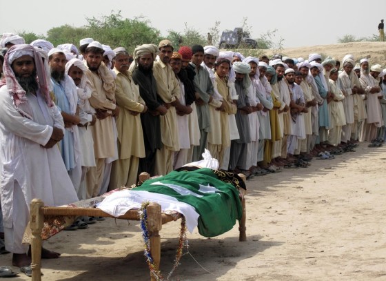 Image: Mourners offer funeral prayers for a policeman killed during an attack by Taliban militants