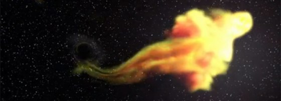This still photograph from a NASA video animation depicts the supermassive black hole Swift J1644+57 eating a big star, a process that scientists witnessed for the first time using the Swift satellite.