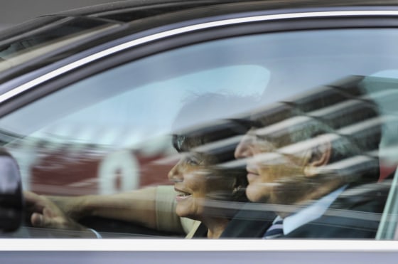 Image: Former IMF Managing Director Strauss-Kahn and his wife Anne Sinclair depart the IMF headquarters in Washington