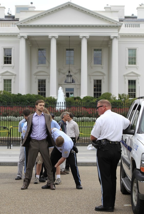 Image: A protestor is arresed in front of the White House
