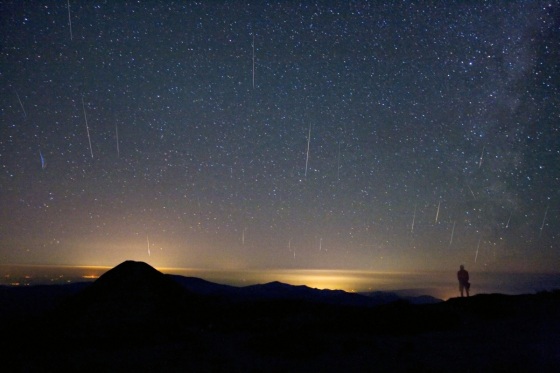 A mountaintop above the clouds and light-polluted cities of Romania served as a good spot for astrophotographer Alex Tudorica to watch the 2008 Perseid meteor shower. This composite picture from one of the highest points in Romania, the Omu summit (2,507 meters) in the Southern Carpathian Mountains, captured about 20 of the shower's bright streaks.