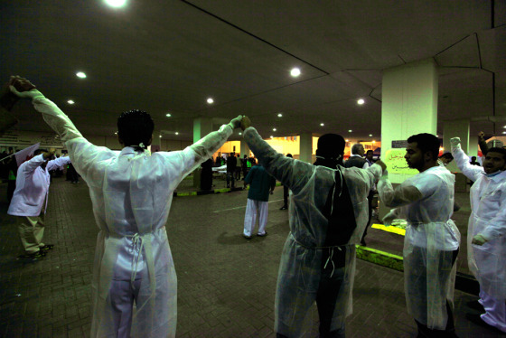 Doctors form a human chain at Salmaniya Hospital fearing an attack by riot police in Manama, Bahrain, on March 15.