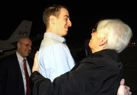 Image: Ilan Grapel (C), a US-Israeli citizen accused of spying in Egypt, hugging his mother Irene
