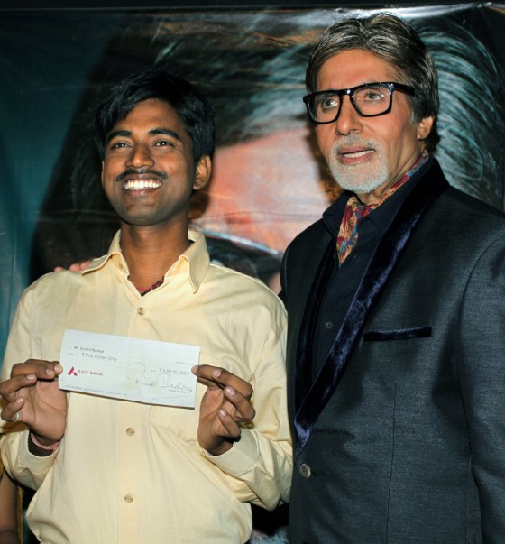 Sushil Kumar, left, with Bollywood actor Amitabh Bachchan, shows his $1 million check after his appearance on the popular Indian version of "Who wants to be a Millionaire."