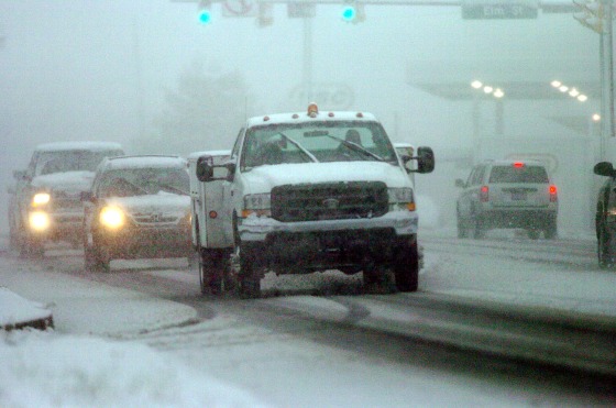 Image: Vehicles travel slowly in near white out conditions along State Route 309