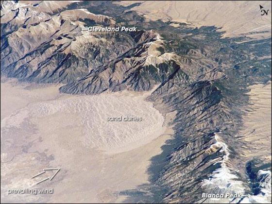 The Sangre de Cristo Mountains of south-central Colorado stretch dramatically from top left to lower right of this astronaut photograph.