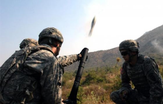 A 60 mm high-explosive round launches from the tube of an M-224 Company Mortar System Feb. 11, as the 3rd Battalion, 509th Parachute Infantry Regiment, gun team readies the next shot at Pulon Range, Thailand, during Cobra Gold 2011.
