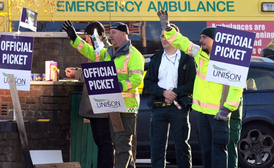 Image: Workers picket outside the Bournbrook Ambulance Station during a public sector strike over pensions in Birmingham, England.