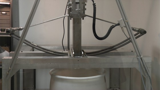 This is a photo of the ballista test bed preparing to fire a prototype harpoon into a bucket of material that simulates a comet.