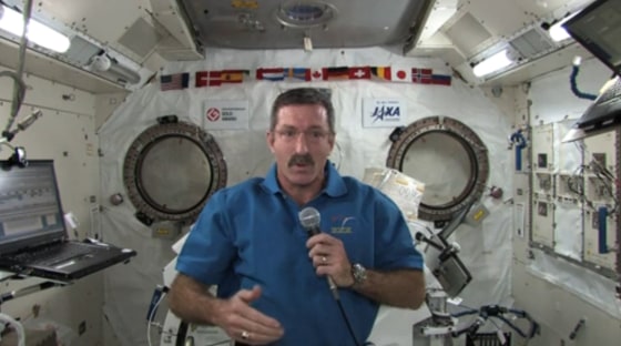 NASA astronaut Dan Burbank, commander of the International Space Station, sent holiday wishes on Dec. 15 for peace on Earth — from high above it.