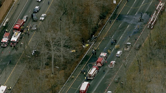 Emergency workers gather at the scene of the plane crash Tuesday in New Jersey.