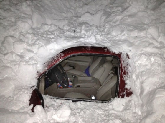 Image: car in snowdrift after Texas family was rescued