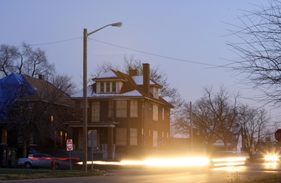 Image: A lone streetlight, one that survived the mass removal of streetlights this year to save the city money, in Highland Park, Mich.