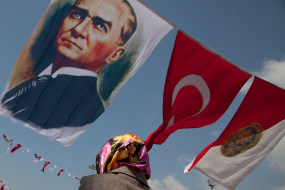 A Turkish flag and one emblazoned with the face of Mustafa Kemal Ataturk wave in Istanbul's Taksim Square. When the Ottoman Empire crumbled after the First World War, Ataturk defeated the Allies and worked to establish a Westernized and strictly secular state. The founder of the Turkish Republic is still adored by many and his likeness is widely on display throughout the country. 