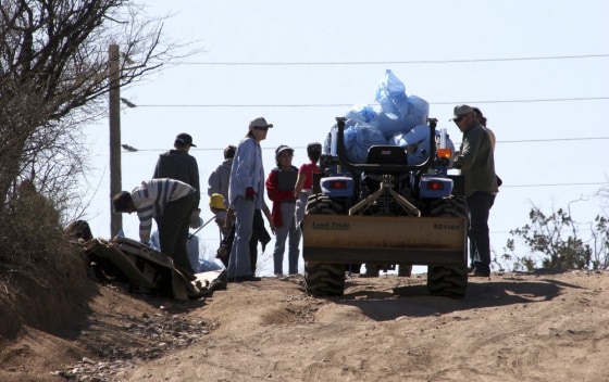 Image: Volunteers collect trash along the Santa Cruz River in Rio Rico