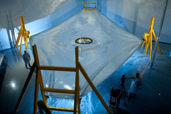 A full-scale JWST sunshield membrane deployed on the membrane test fixture at Mantech, Hunstville. The JWST sunshield comprises five of these layers, each of which has to be precisely spaced with respect to the next.