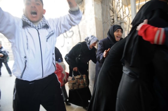 Image: Syrian civilians flee following an attack in the centre of Idlib, Syria
