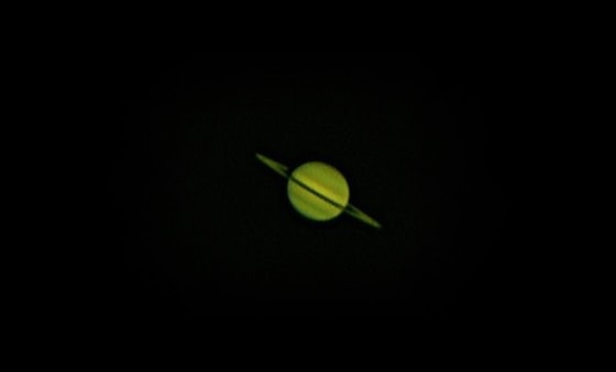 This photo of Saturn was imaged with 2,800 individual frames stacked with Registax, using a webcam and telescope.