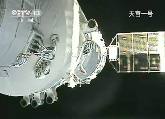 This still photo taken from a video shows China's Shenzhou 8 spacecraft docked with the Tiangong 1 lab module on Nov. 3, 2011.