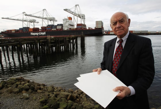 Image: Harrington, president of American Pulp and Paper Corporation of Redmond, Washington, holds samples of \"fluff pulp\" that is used in diapers and women's feminine hygiene products in Seattle