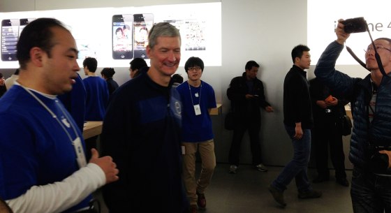 Image: Apple CEO Tim Cook talks to employees at an Apple store in central Beijing
