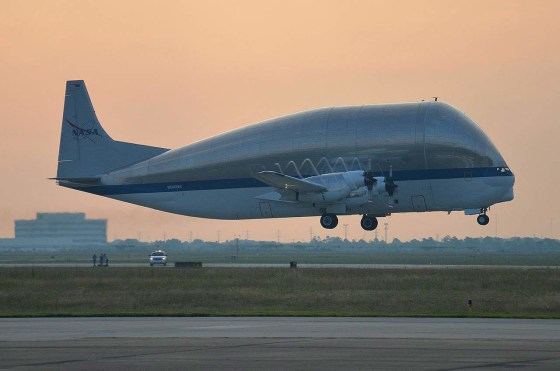 NASA's Super Guppy cargo aircraft takes off from Ellington Field in Houston carrying NASA's space shuttle trainer crew cabin on Wednesday. The cargo is bound for The Museum of Flight in Seattle.