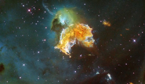 The remains of a once-explosive supernova illuminate part of a nearby galaxy in this image taken by the Hubble Space Telescope.