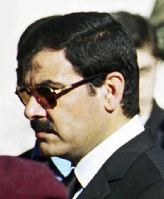 Image: File photo of Assef Shawkat standing during funeral of late President Hafez al-Assad in Damascus