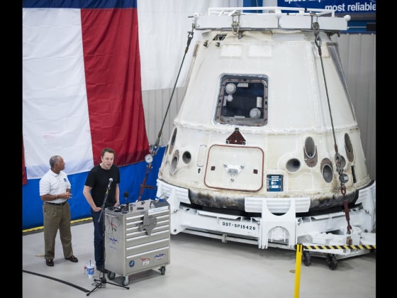NASA Administrator Charles Bolden, left, and SpaceX Chief Executive Officer Elon Musk view the historic Dragon capsule that returned to Earth on May 31 following the first successful mission by a private company to carry supplies to the International Space Station. This picture was taken June 13, 2012 at a SpaceX facility in McGregor, Texas.