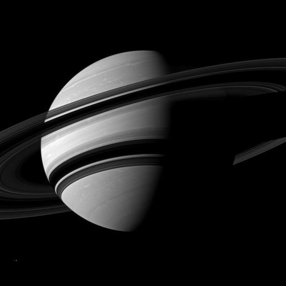 NASA's Cassini spacecraft snapped this angled shot of Saturn, showing the southern reaches of the planet with the rings on a dramatic diagonal. Saturn's icy moon Enceladus is visible as a tiny white speck in the lower lefthand corner. The picture was taken on June 15 at a distance of about 1.8 million miles.
