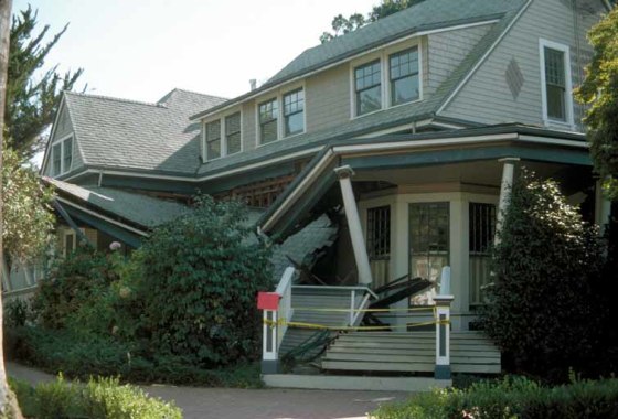 A house remains intact, though its porch collapsed, after the 1989 Loma Prieta earthquake in Northern California. Experts say it's safer to stay in place during a quake.