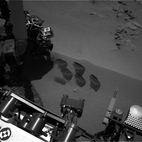 Bite-marks on Mars. NASA’s Mars rover Curiosity used a mechanism on its robotic arm to dig up five scoopfuls of material from a patch of dusty sand called “Rocknest.” Each of the pits is about 2 inches (5 centimeters) wide. A sample from that fifth scoop was analyzed by Curiosity’s Sample Analysis at Mars (SAM) instruments inside the rover. A second sample from the same scoopful of material was delivered to SAM for analysis on Sol 96 (Nov. 12).