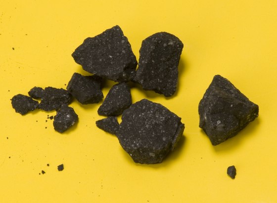 A handful of Sutter's Hill meteorite fragments collected on April 24, two days after the fall. Two months later, the scientists reported having 77 meteorite fragments.