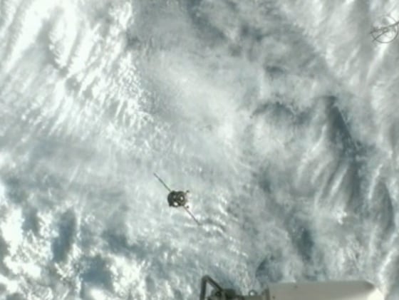 The Soyuz TMA-07M spacecraft approaches the International Space Station for docking on Friday, carrying three new crew members for the Expedition 34 mission.
