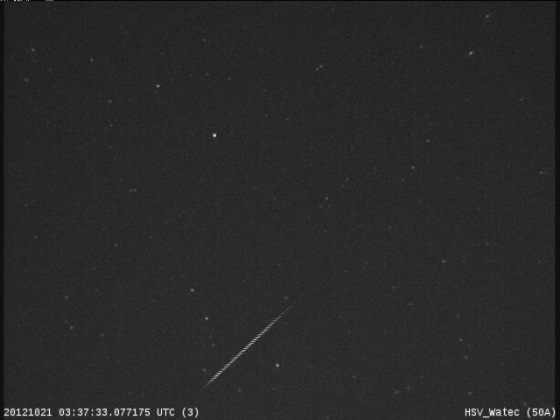 An Orionid meteor streaks across the night sky over Huntsville, Ala., in this view from a camera at NASA's Marshall Space Flight Center before dawn on Oct. 21, during the peak of the Orionid meteor shower.