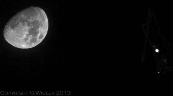 Skywatcher Greg Wigler captured this photo of Jupiter near the moon on Monday during an extreme close encounter. The image also shows two Jovian moons and a star.
