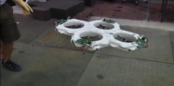 Four hexagonal robots, each with a propeller at its center, hook up using magnets to create one stable flying machine.