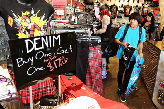 Image: Customers shop at a Hot Topic store in Los Angeles. The retailer says back-to-school shopping picks up after school starts.