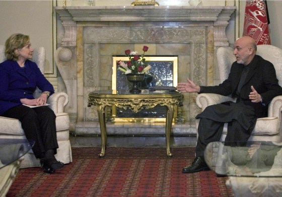 Image: Afghan President Hamid Karzai, right, speaks with U.S. Secretary of State Hillary Rodham Clinton