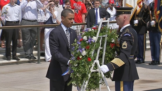 President Barack Obama participates in a wreath-laying ceremony at the Tomb of the Unknowns at Arlington National Cemetery.