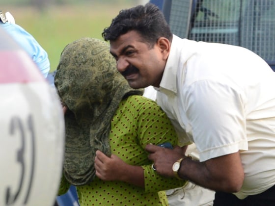 Image: Pakistani security personnel shift Rimsha Masih, a Christian girl accused of blasphemy, to a helicopter