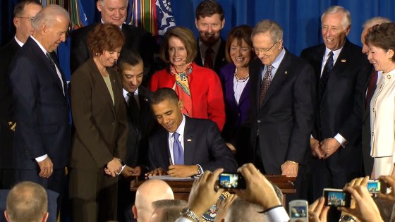 President Obama signs into law the repeal of "don't ask, don't tell" in Washington on Wednesday.
