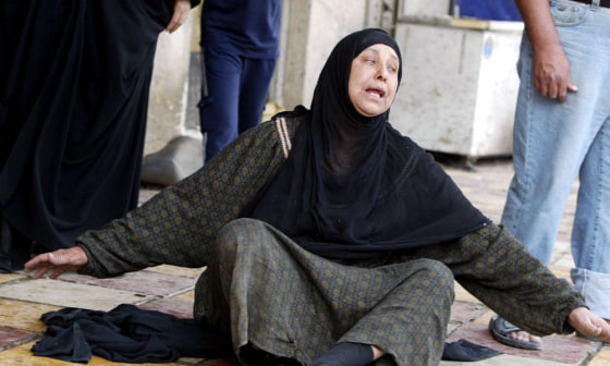 Image: Iraqi woman weeps at the site of a suicide attack