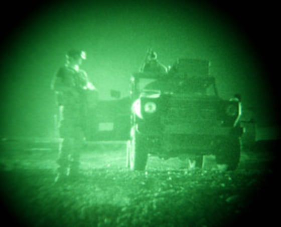 An image taken through night vision glasses shows soldiers in northern Afghanistan. New technology could make night vision more widely available.