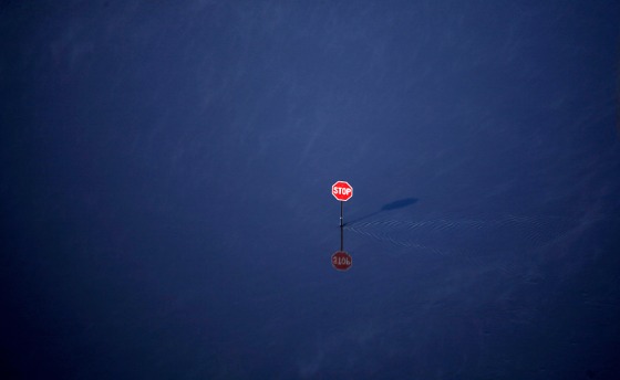 A road is covered by floodwaters as the Red River continues to rise on Saturday, March 28 in Fargo, N.D.